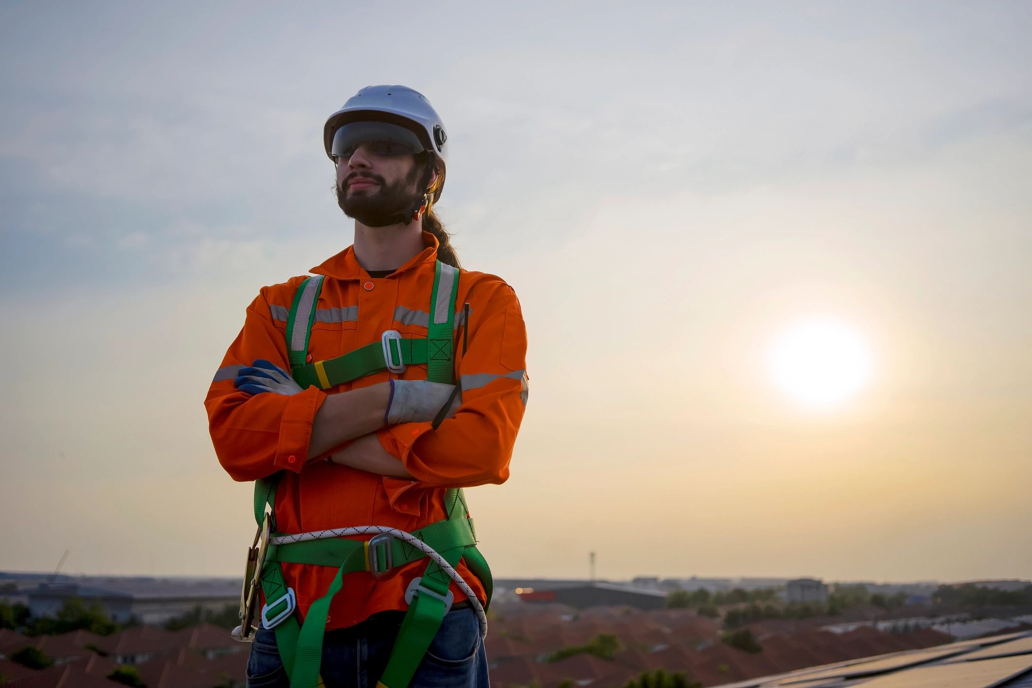 Worker on a rooftop installing equipment