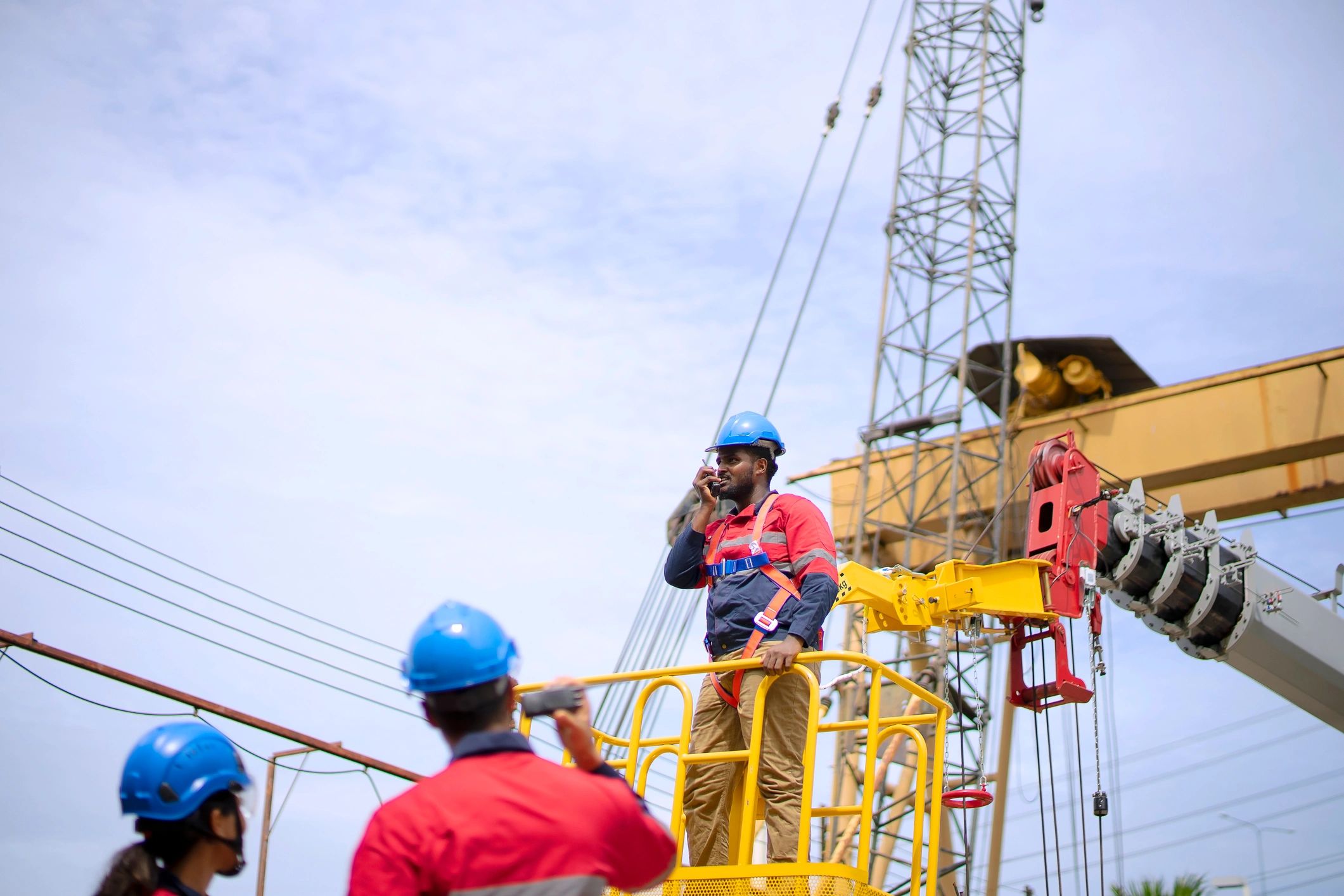 Engineers reviewing plans at an active construction site