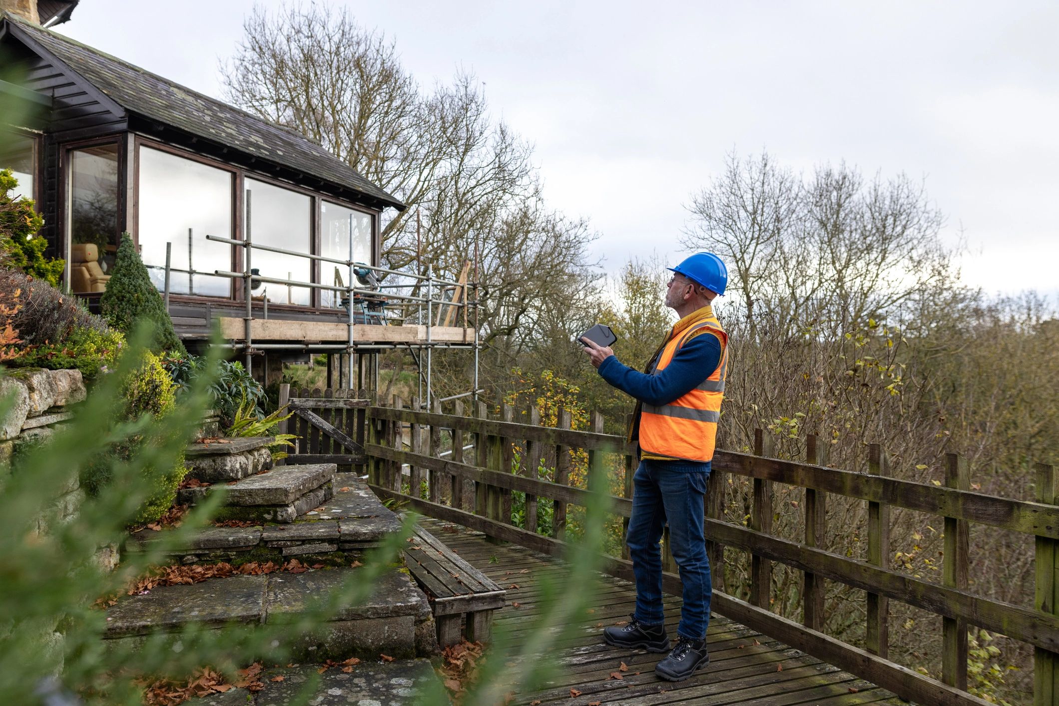 Technician operating a drone for roof survey and moisture investigation support