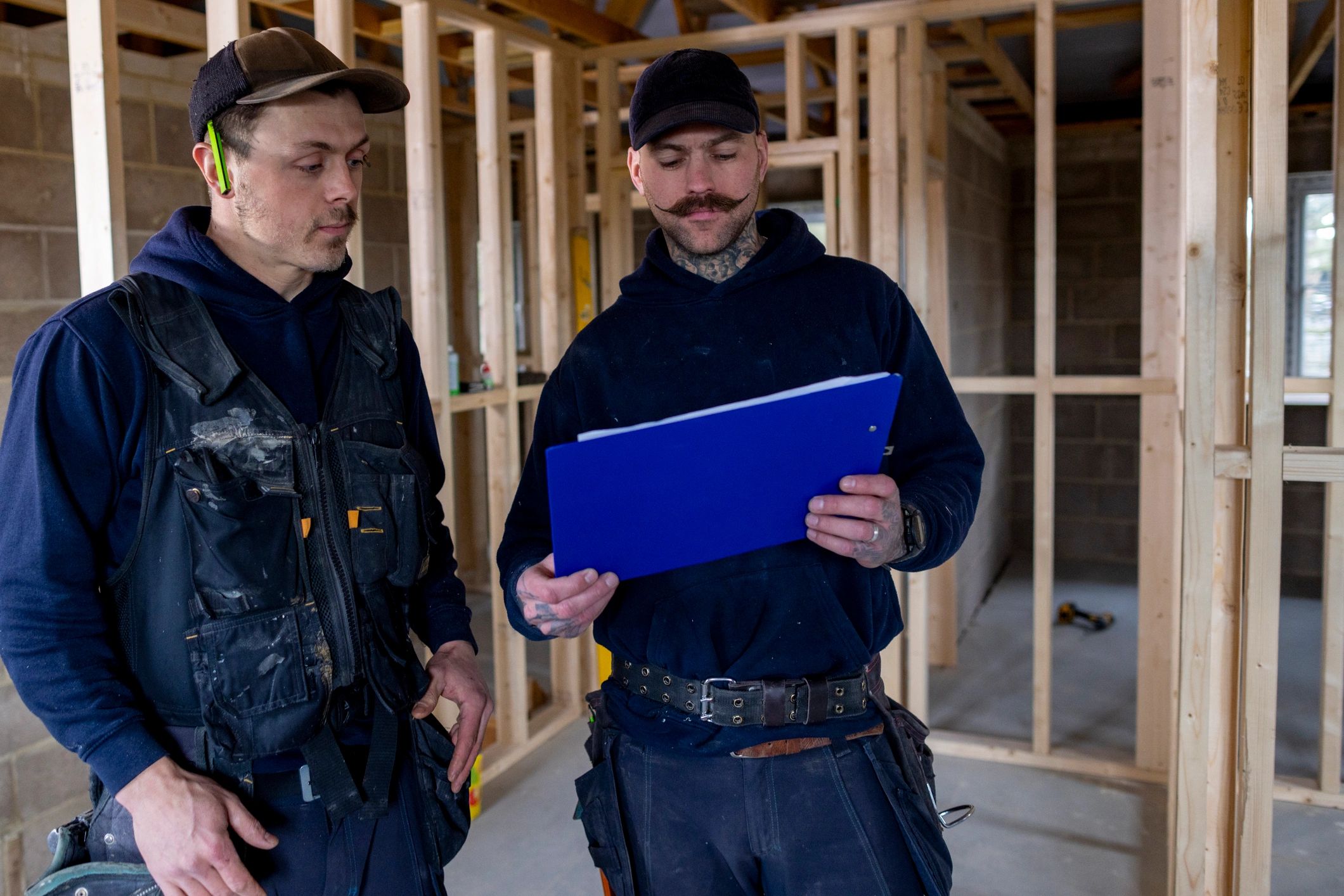 Construction team reviewing plans and documentation on site